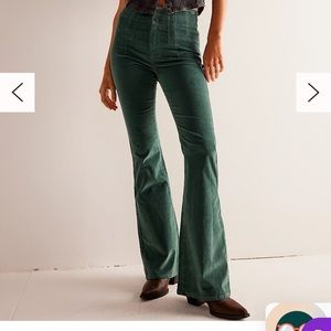 Free People green corduroy flare pants with raw hem. Size 28